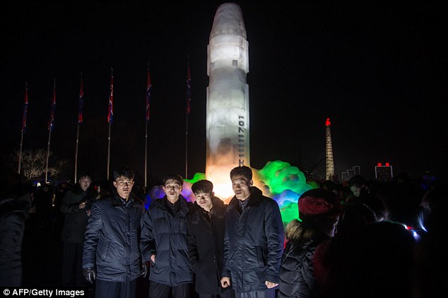 http://reho.st/i.dailymail.co.uk/i/pix/2018/01/01/01/47AA0D2F00000578-5225201-A_group_of_men_stand_before_an_ice_sculpture_depicting_a_Hwasong-a-16_1514771568990.jpg